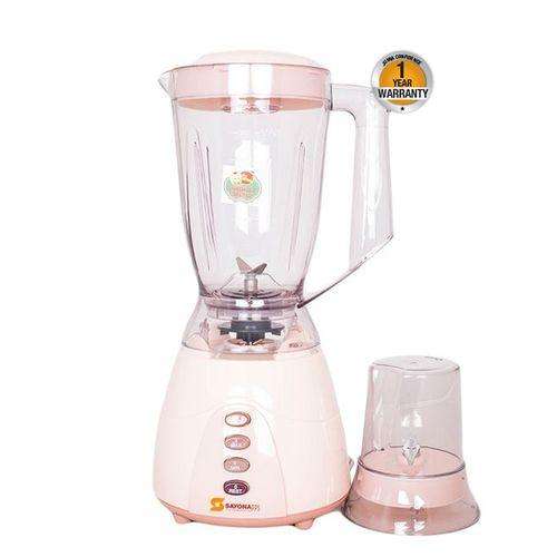 Pink juicer blender with clear pitcher, base, and small blending jar