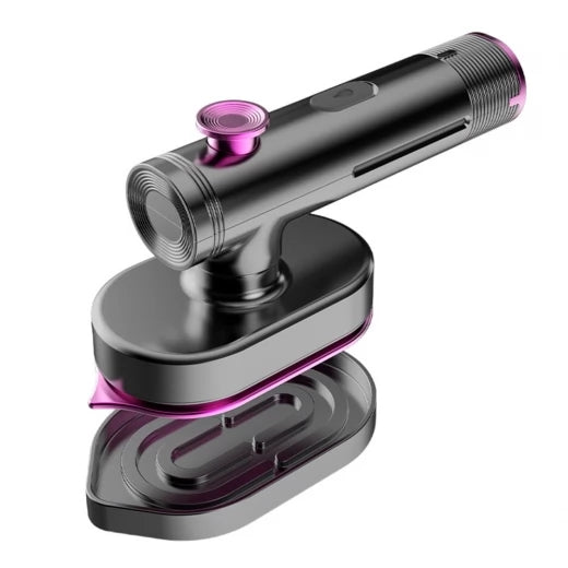 Portable mini ironing machine in black with pink accents and steam vent head