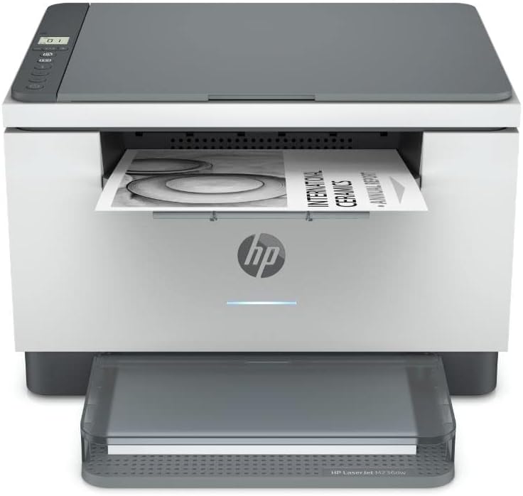 White HP laser multifunction printer with open output tray and paper, front view