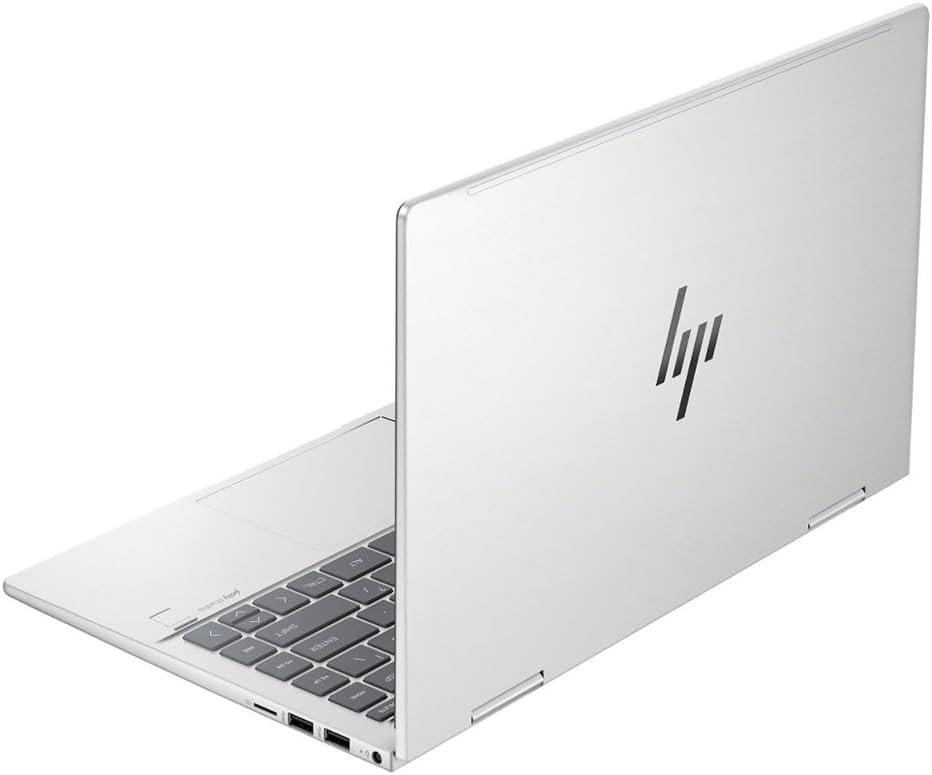 Silver laptop back panel with HP logo and keyboard edge with trackpad