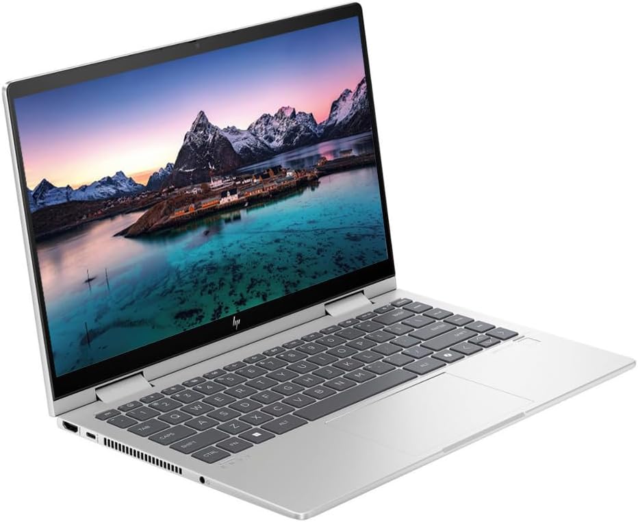 Silver 14-inch touchscreen laptop in angled view, showing keyboard and touch controls