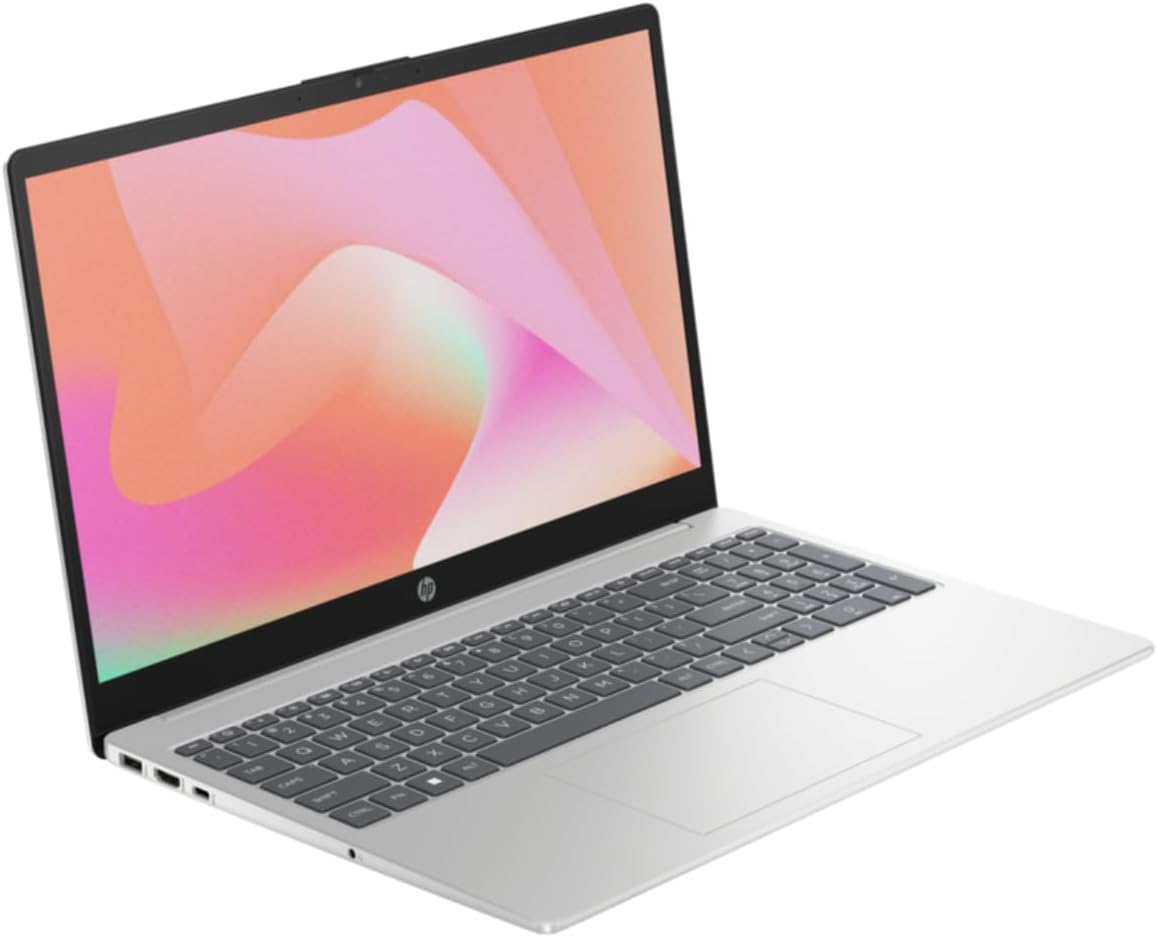 Silver HP laptop open in 3/4 view, showing keyboard and display