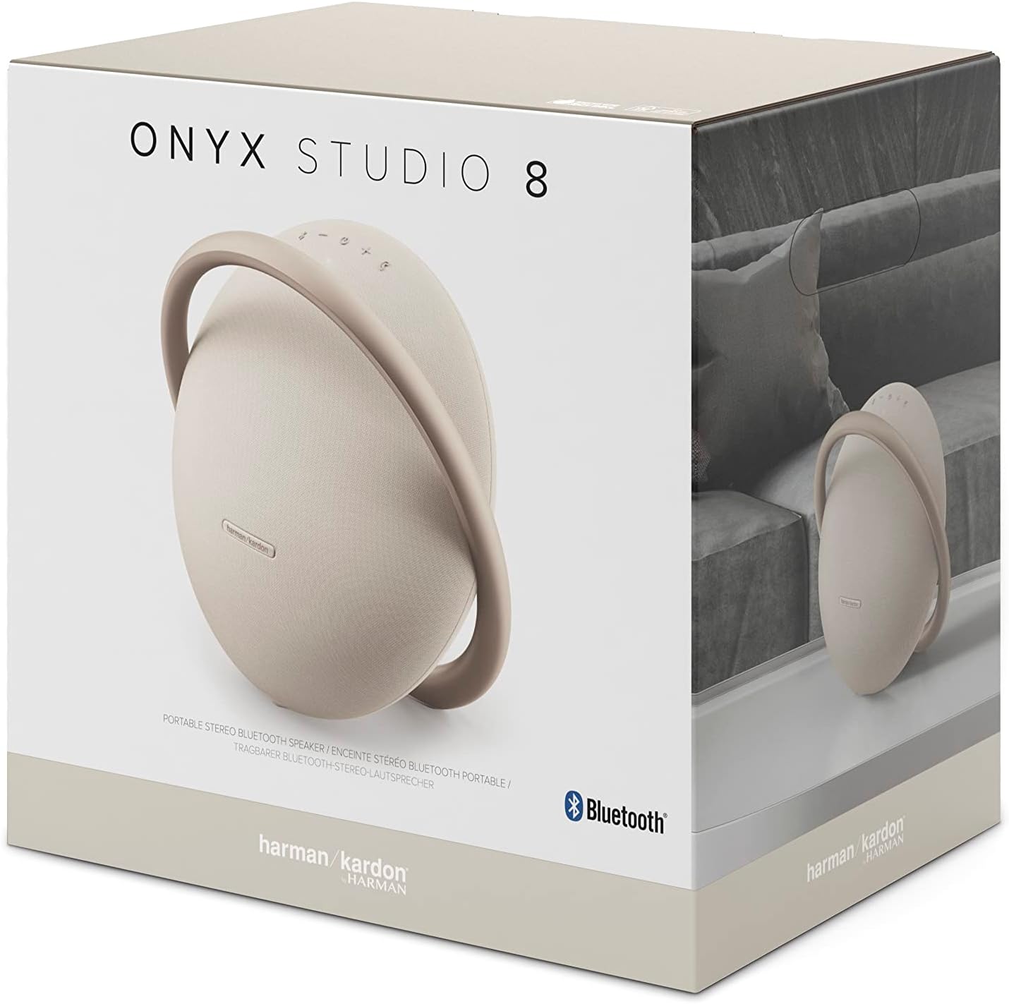 Portable Bluetooth speaker in champagne on retail box, showing ear-shaped front design