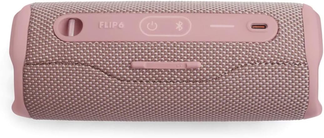 Pink JBL Flip 6 speaker back with charging port and buttons along the top