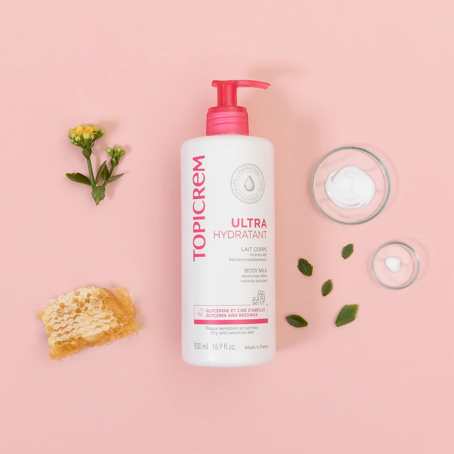 Topicrem Ultra Hydratant body milk lotion bottle with pink pump and open cream jars