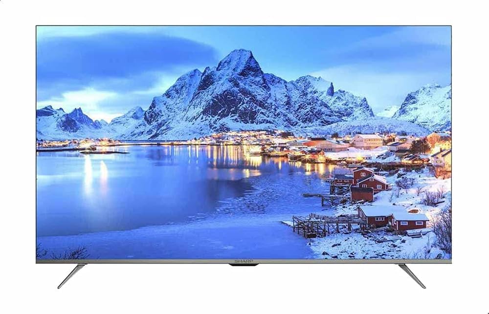 Sharp 55-inch 4K TV with snowy mountain landscape on widescreen display
