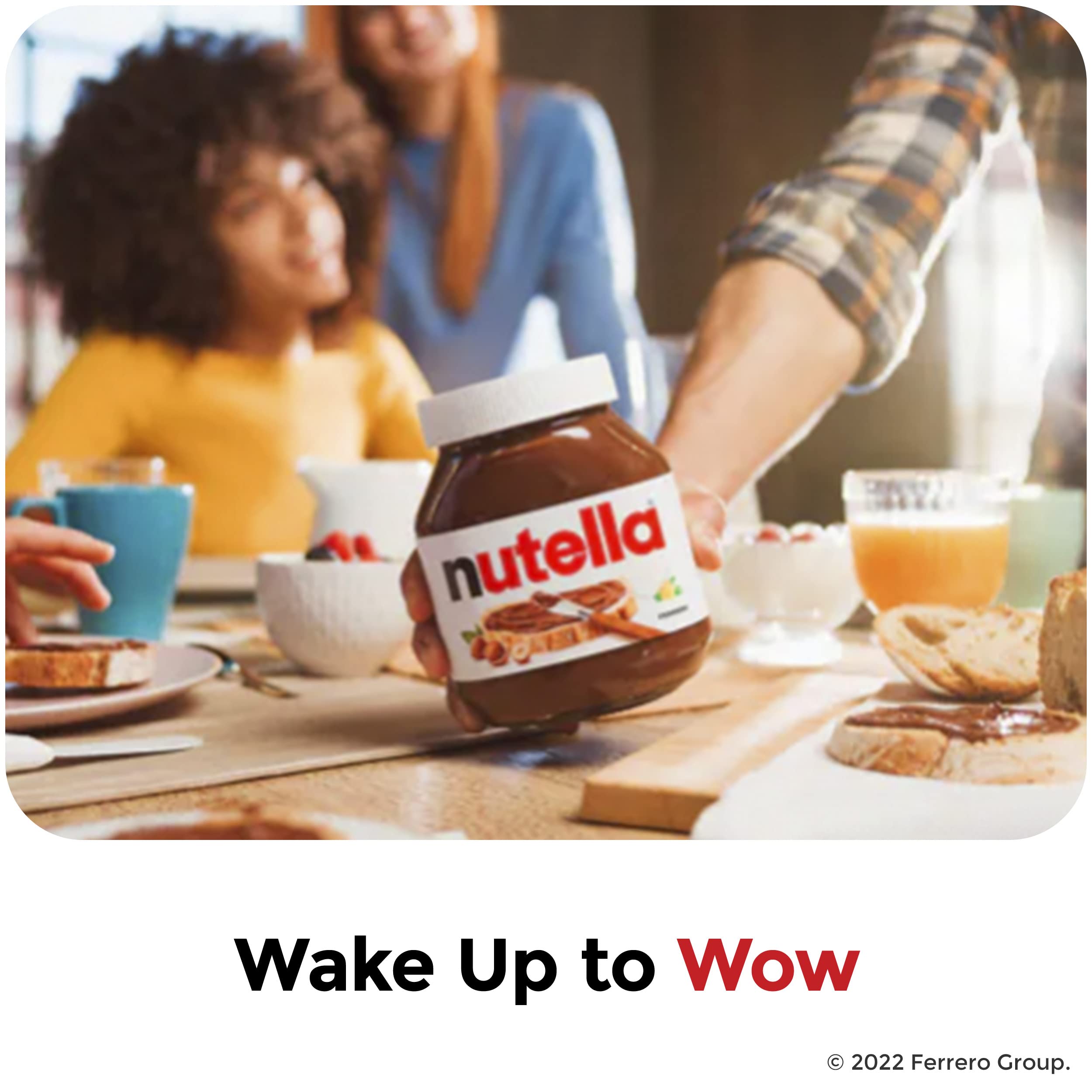 Nutella jar on breakfast table with cups and pastries