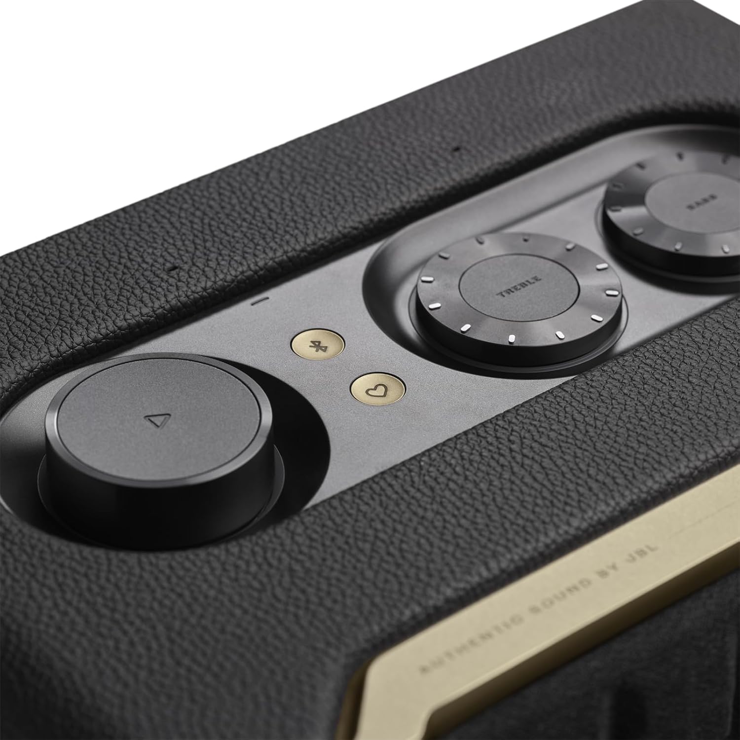 JBL smart home speaker top close-up showing control knobs on textured surface