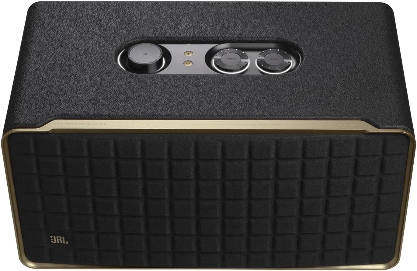 Black JBL speaker with control panel and textured front grille, gold trim