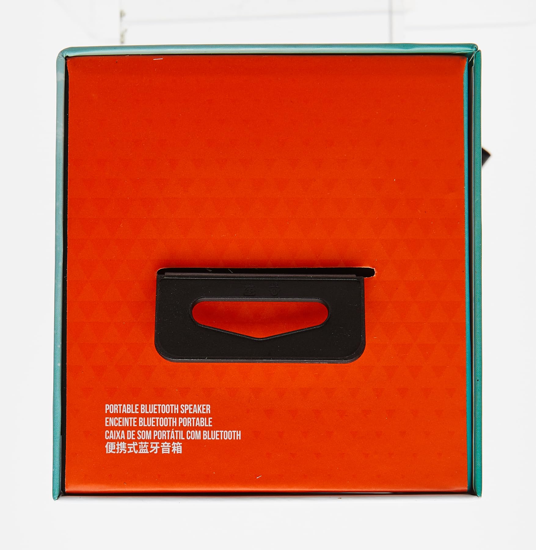 JBL Flip 6 portable Bluetooth speaker box with orange insert and black carry handle