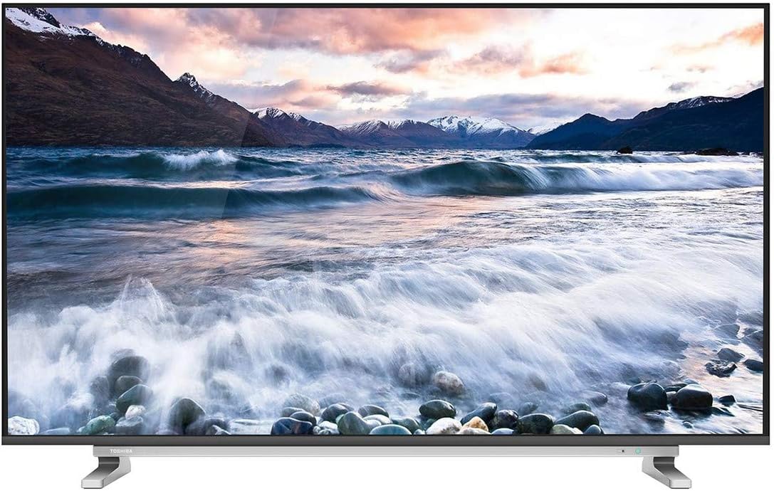 Toshiba 50-inch 4K LED Smart TV with ocean scene on screen and dual desktop stands