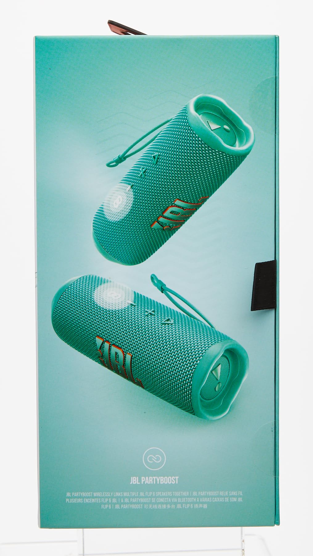 JBL Flip 6 retail package showing teal portable Bluetooth speaker with strap loop
