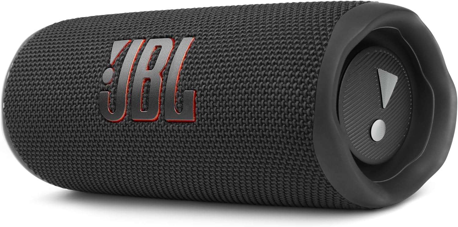 Portable JBL Flip 6 speaker with black fabric grille and side control buttons