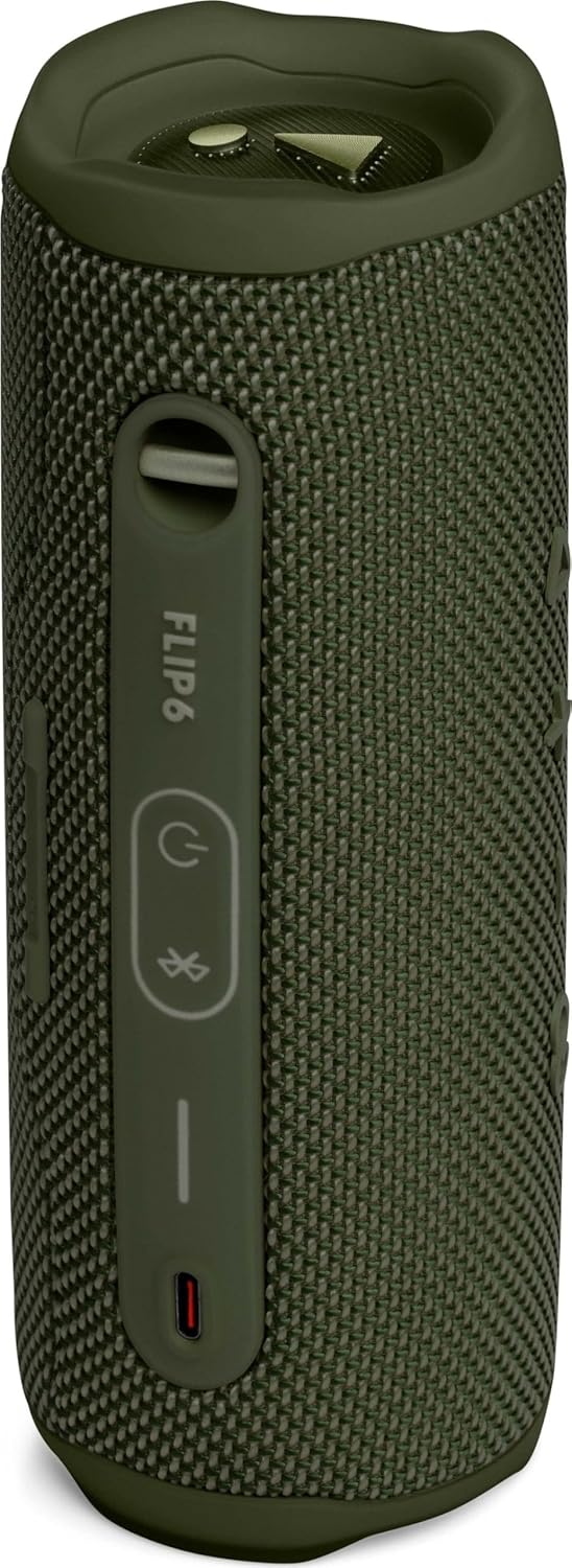 Portable JBL Flip 6 speaker in green camo fabric with side buttons and strap loop