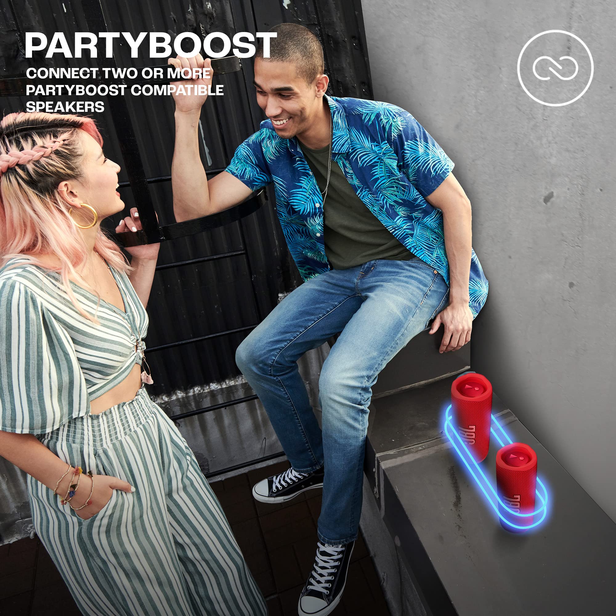 JBL Flip 6 red portable speaker with glowing wireless PartyBoost indicator