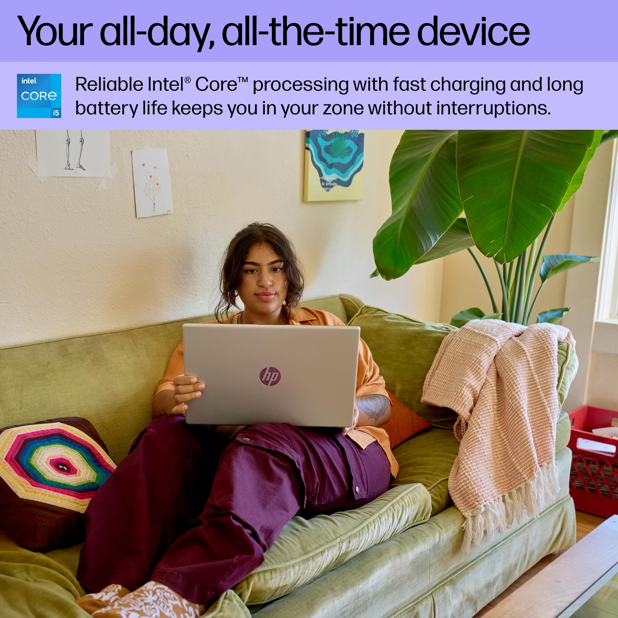 HP laptop on couch in use, showing screen and black keyboard
