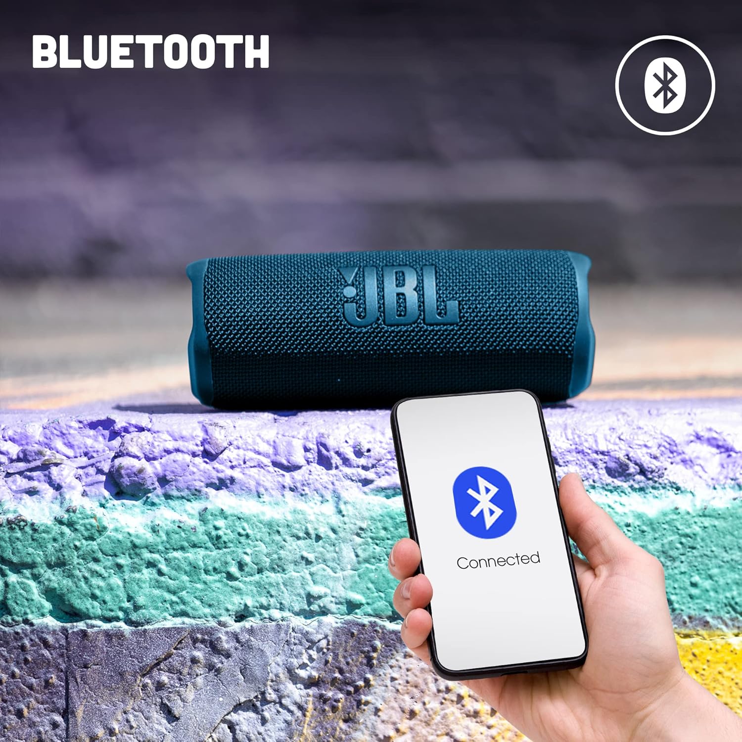 JBL Flip 6 portable speaker, blue fabric grille with JBL logo on front