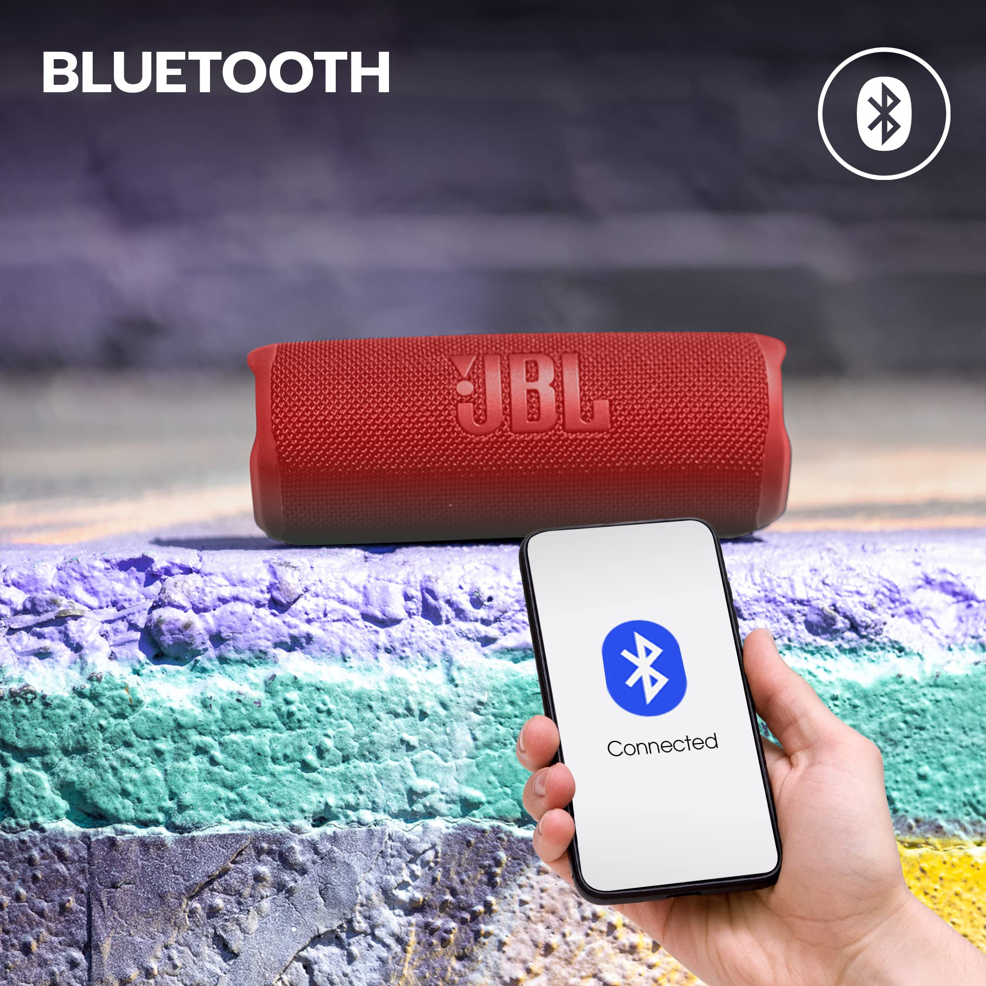 Portable waterproof Bluetooth speaker with fabric mesh grille and JBL logo, red