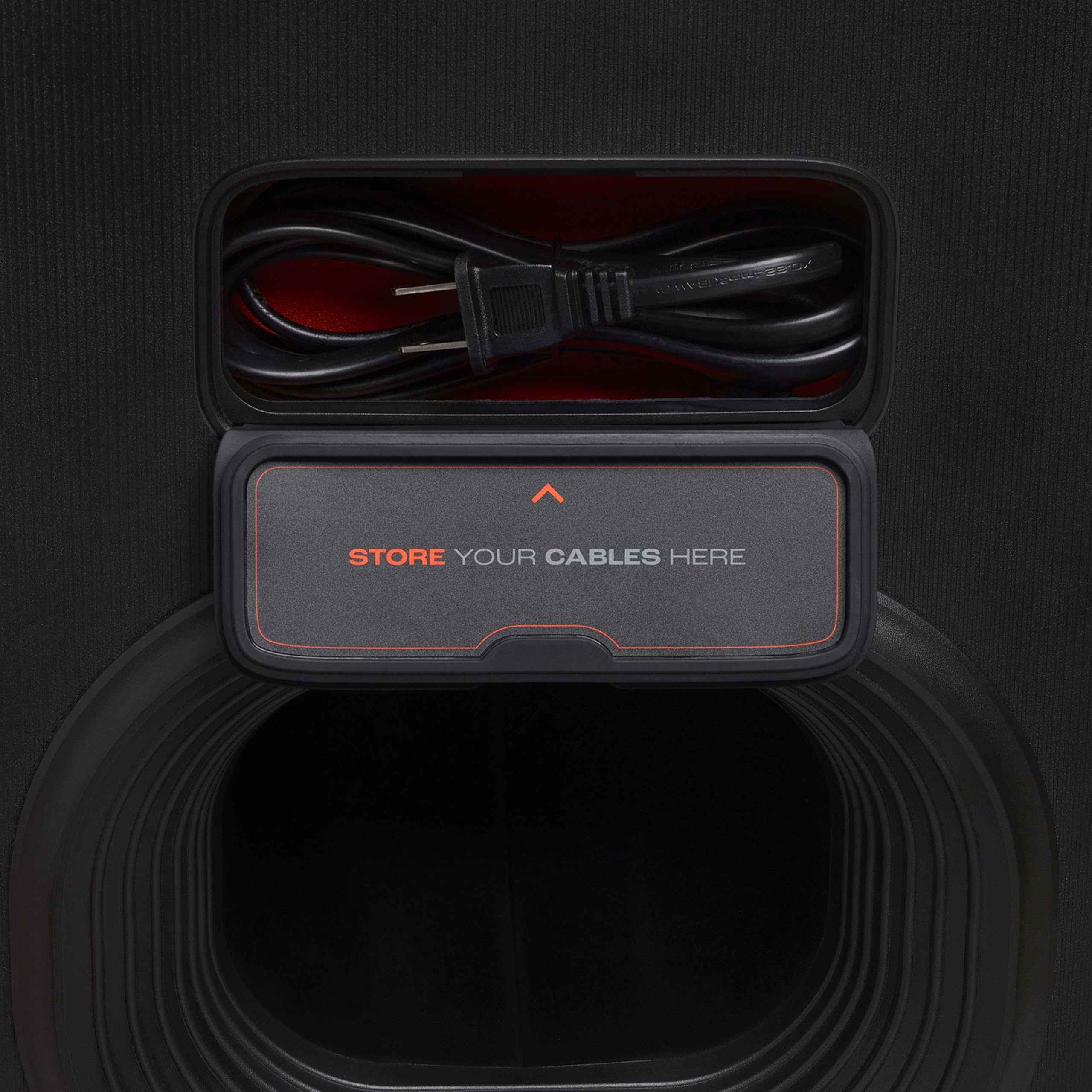 JBL portable Bluetooth speaker with open cable storage compartment