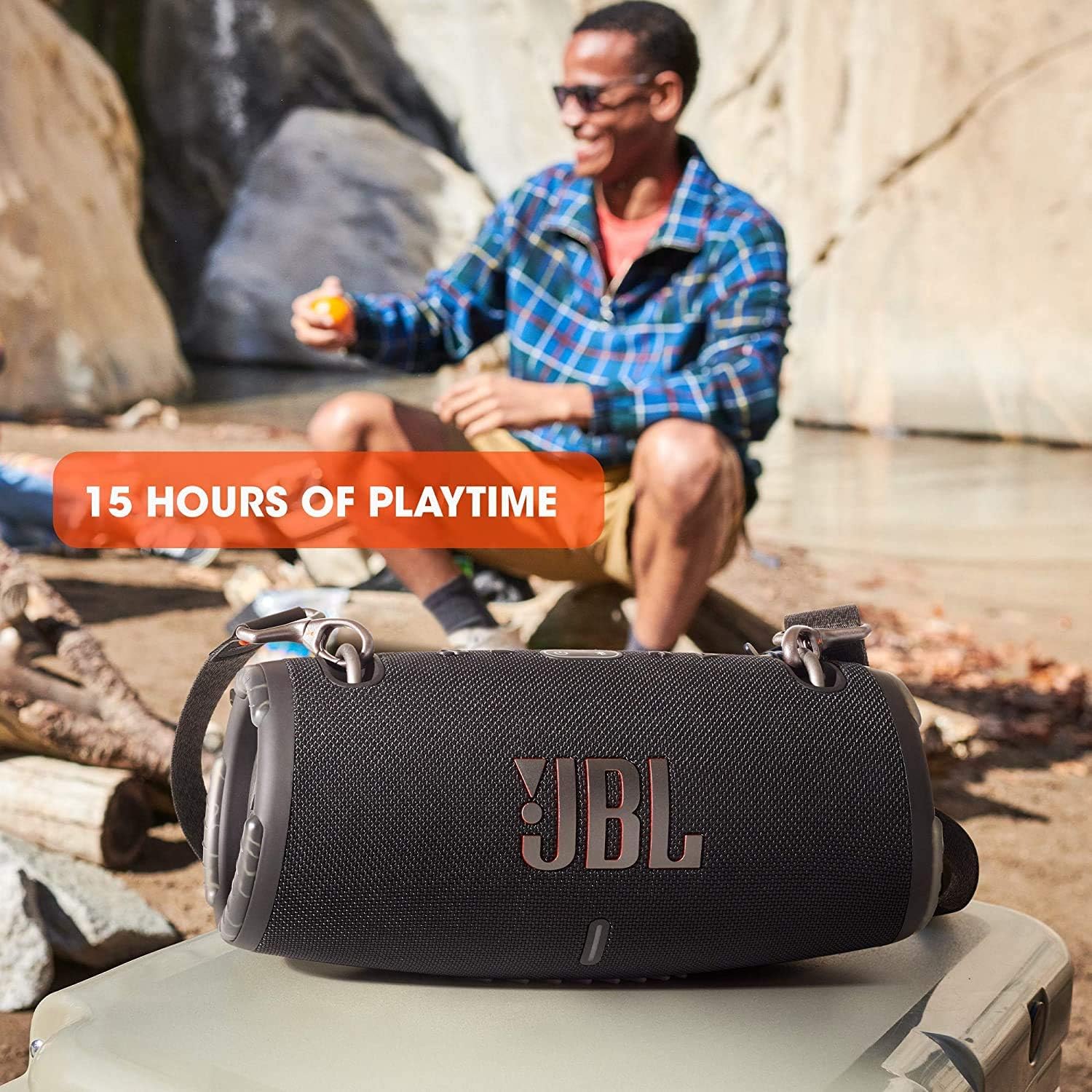 Portable waterproof speaker with JBL logo on dark grille and protective rubber end caps