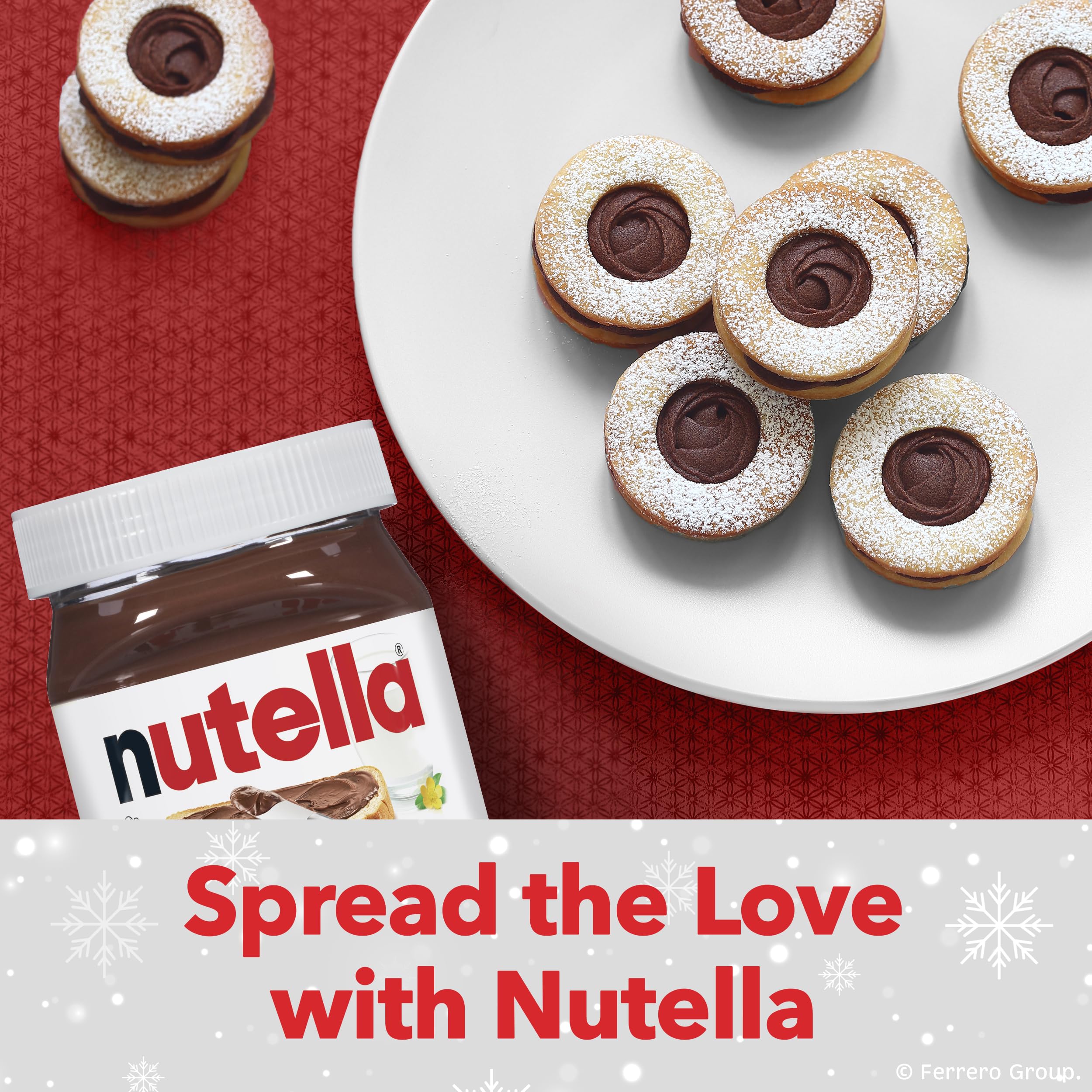 Nutella jar with swirl-topped mini cakes on a white plate and red cloth