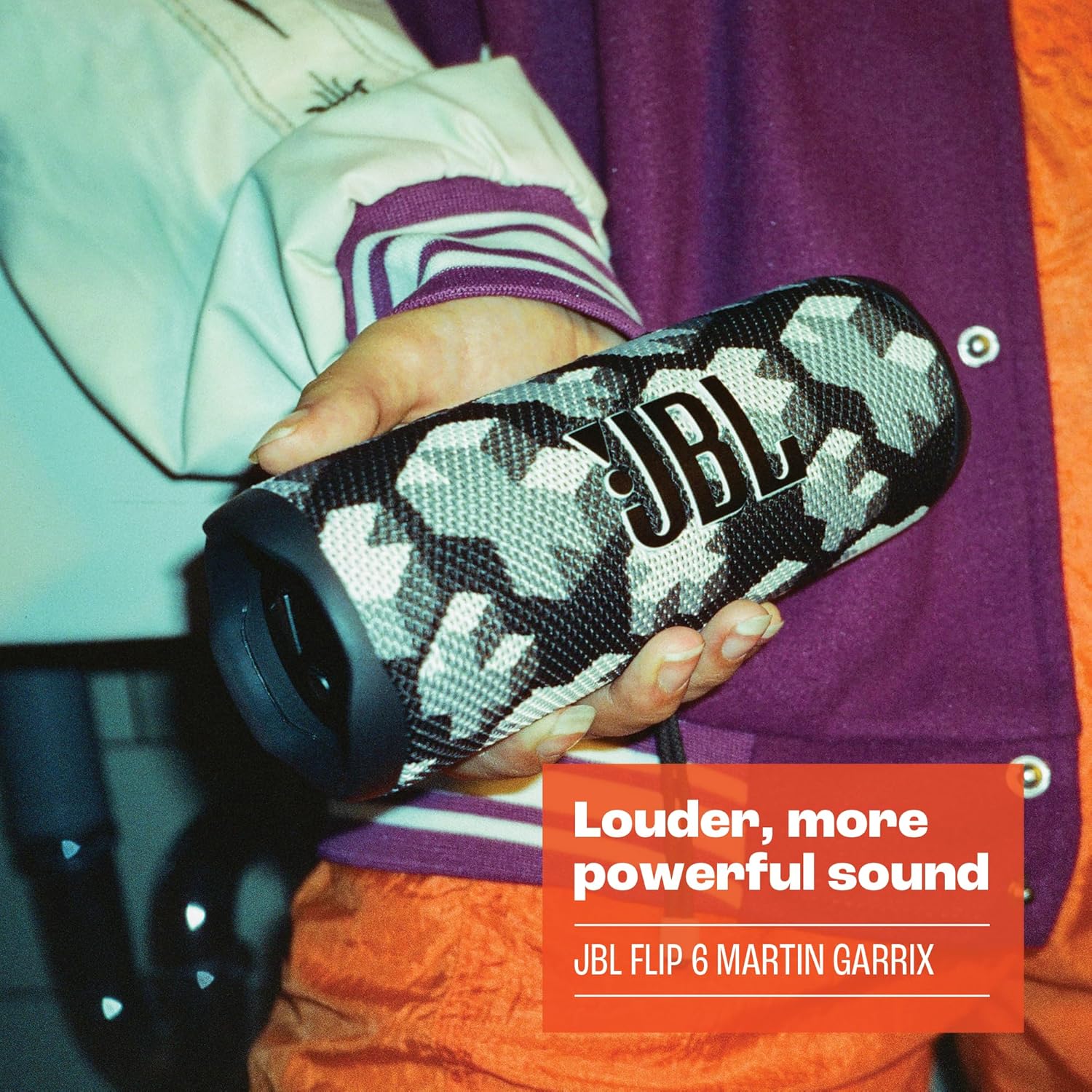 JBL Flip 6 camo portable speaker with Martin Garrix style fabric held in hands