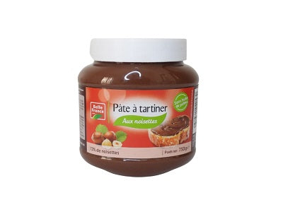 Hazelnut spread jar with white lid, dark brown chocolate-nut filling, front label