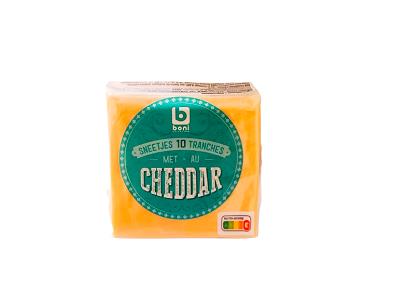Cheddar cheese in plastic-wrapped block, orange with green label on front