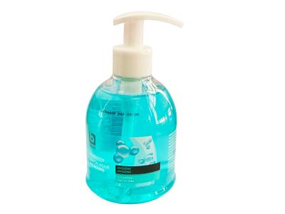 Liquid hand soap dispenser bottle with white pump, turquoise liquid