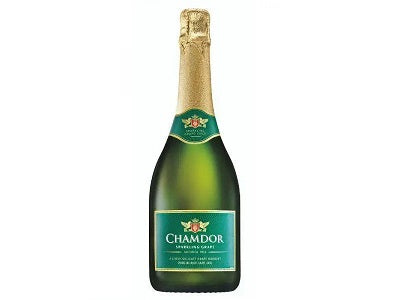 Sparkling white wine bottle with green foil top and label