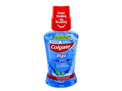 Mouthwash bottle with red cap and blue Plax label