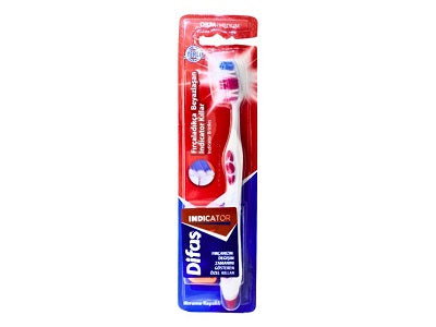 Indicator toothbrush with colored bristles in red blister packaging