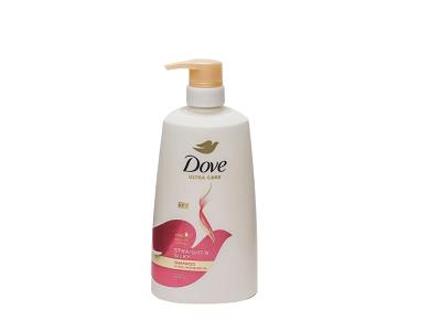 Dove shampoo bottle with pump dispenser, white body and pink label