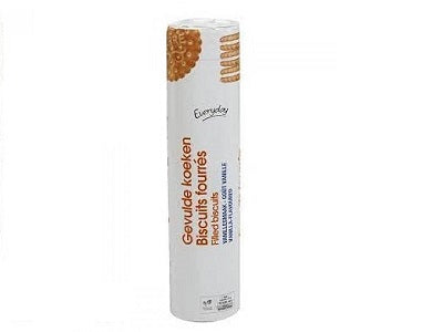 Cylindrical candle with vanilla label in white paper sleeve