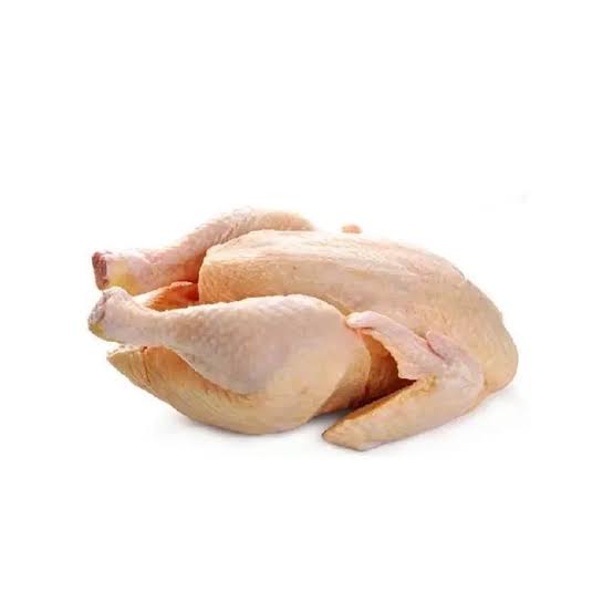 Whole raw chicken with wings and legs, pale skin