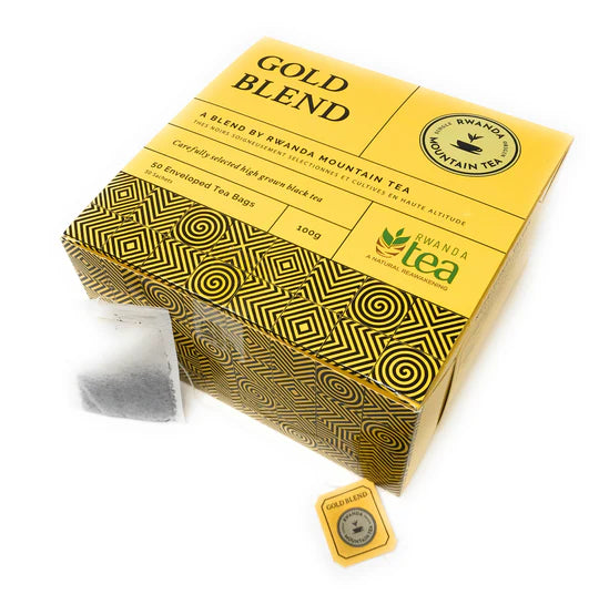 Gold tea blend box with patterned gold geometric wrap and hanging tag