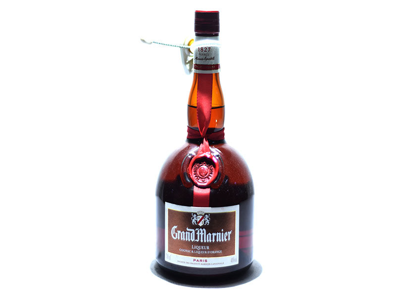 Grand Marnier liquor bottle with dark glass and red cap, front label visible