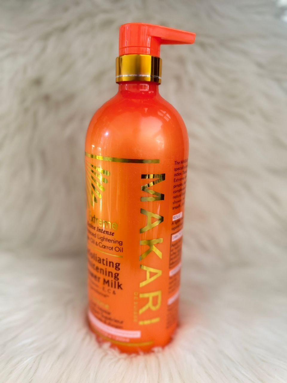 Makari body lotion bottle, orange with red pump dispenser