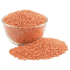 Red masoor dal (lentils) in bowl with loose grains