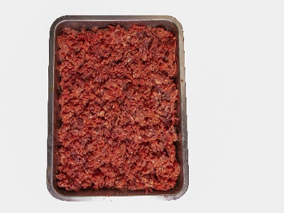 Tray of raw lean minced meat, dark red-brown ground texture
