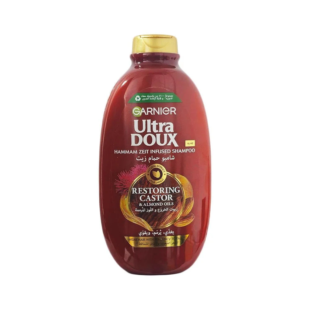 Garnier Ultra Doux restoring castor shampoo bottle with gold cap
