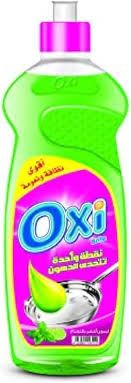 OXI green dishwashing liquid bottle with pink cap and lemon scent label