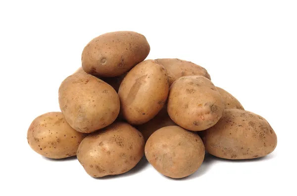 Fresh brown potatoes bundle, unpeeled, with skins and dirt speckles