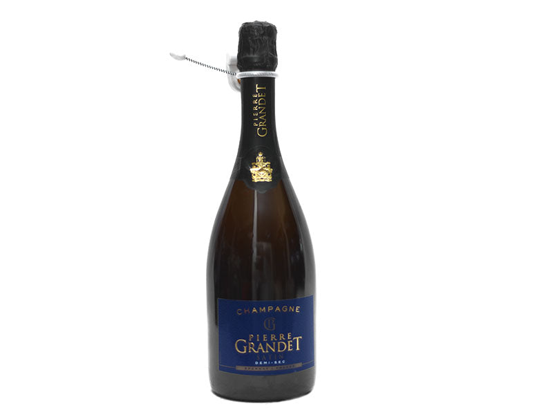 Brut champagne bottle with dark glass, black capsule, wire foil top and blue front label