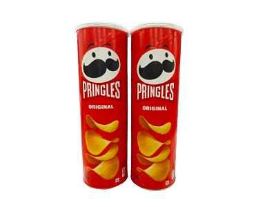 Two red Pringles Original snack canisters with black-face mascot and yellow chips