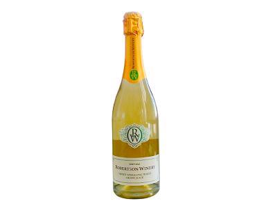 Sparkling wine bottle with pale yellow liquid and gold cap label