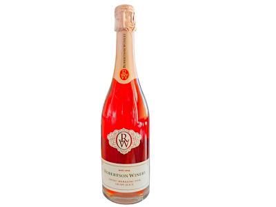 Sparkling wine bottle with pink liquid, gold foil, and crest label
