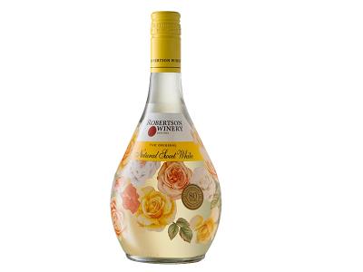 Floral white wine bottle with gold cap and rose artwork on light golden liquid