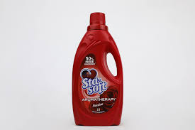Red aromatherapy laundry bottle with front label and pump cap