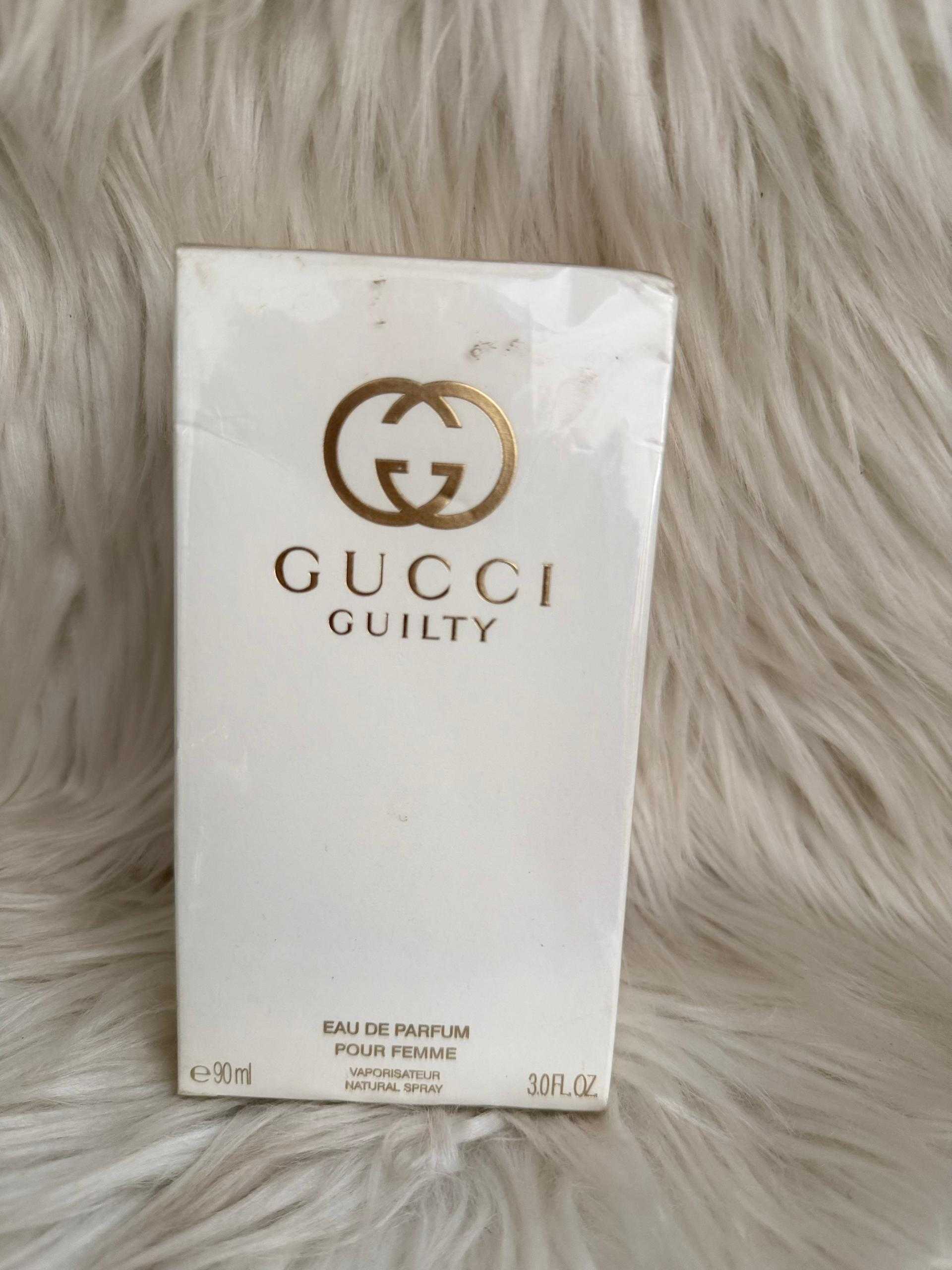 Gucci Guilty eau de parfum bottle in white box with logo